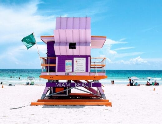 brown wooden lifeguard chair on beach during daytime