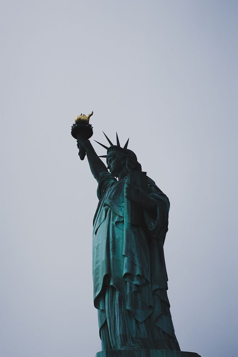 a statue of a person holding a torch